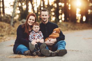 The Schlosser family cuddles their little boys atop a cold Mt. Lemmon during their family photo session in November