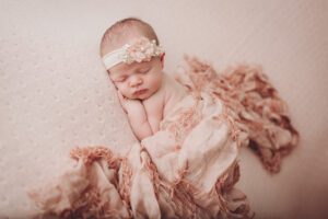newborn girl in all pale pink by Ramstein newborn photographer