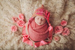 fresh cut pink roses for this newborn girl by wiesbaden newborn photographer