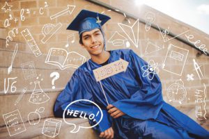 A senior at Catalina Foothills High School gets graphic during his senior session with a photo booth sign and doodle art on the steps of his Tucson high school during his senior session with Belle Vie Photography