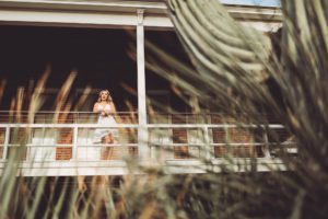 University of Arizona senior, Shelby, looks out from the Old Main at the U of A campus during her senior portrait session