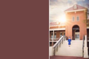 Olivia from the class of 2018 stands on the Old Main steps at the University of Arizona during her senior portrait session with Belle Vie Photography