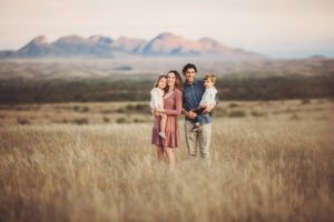 A family at sunset overlooking southern Arizona during their Sonoita photoshoot