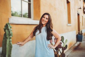 A local woman posing in the heart of downtown Tucson during her headshot photo session