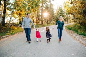 A family walks together during a fall family session atop Mt. Lemmon
