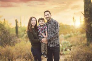 Mom, dad and son at sunset during their holiday family photo session in Tucson