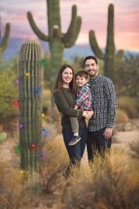 Christmas in the desert with a saguaro decorated in Christmas lights during a holiday family photo session at Sabino Canyon in Tucson