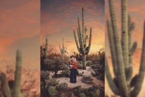 A couple kiss under an Arizona sunset by a giant saguaro during their sunset couple's session in Tucson