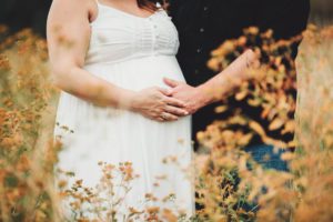 A bump and fall flowers during Adrianna's maternity session
