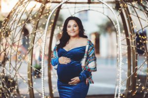 Alex's maternity session ended in Jacome plaza in Tucson in front of a giant holiday ornament covered in lights