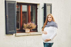 A mom during her fall maternity session in old town Hochheim, Germany