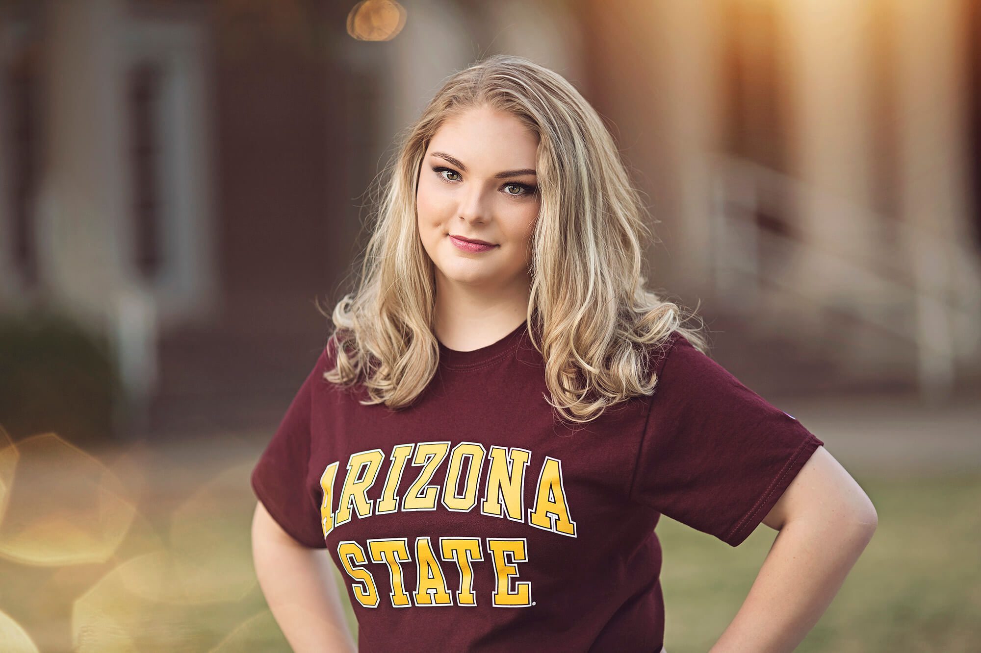 Miss Olivia stands proudly wearing her Arizona State University t-shirt during her senior portrait session