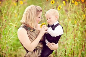 A photo of my son and I five years ago playing with wild sunflowers