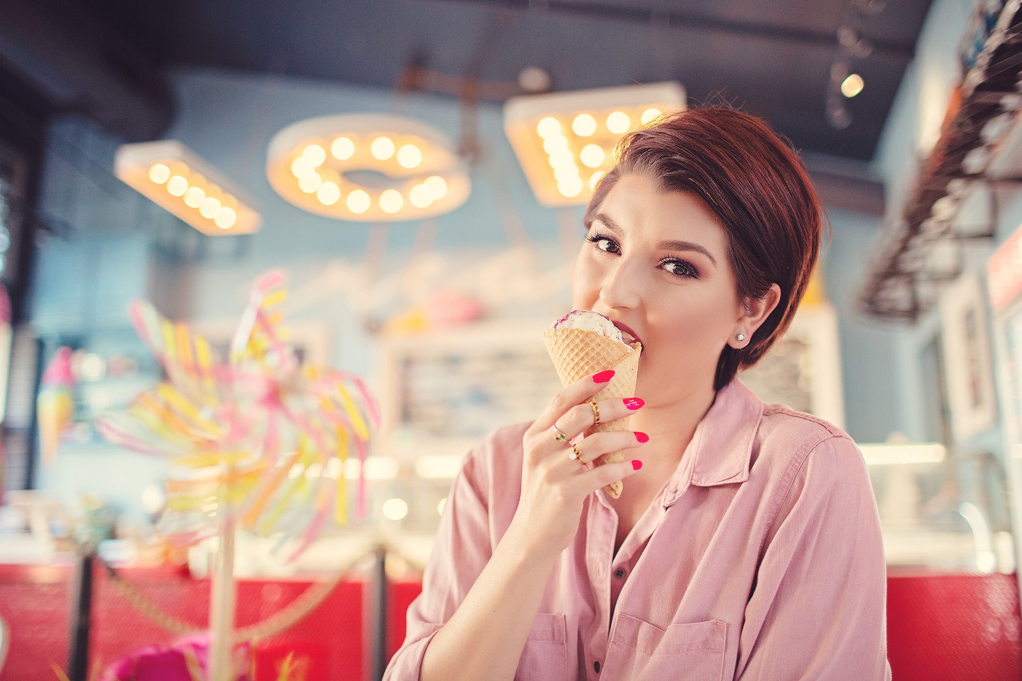 Tucson food blogger Lady Lunching devours a berry ice cream cone while visiting the Hub Ice Cream Factory in downtown Tucson