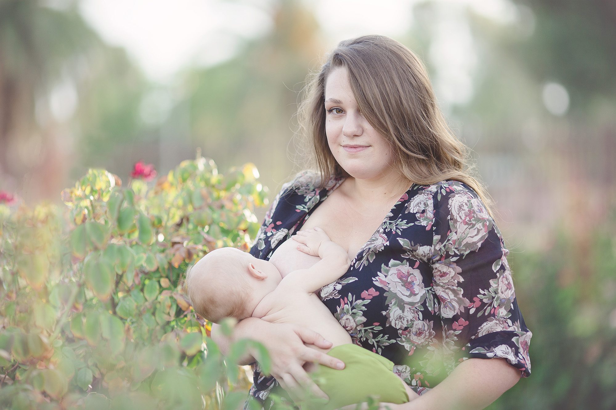 A mom breastfeeds her son during her breastfeeding session in the rose garden at Tucson's Reid Park