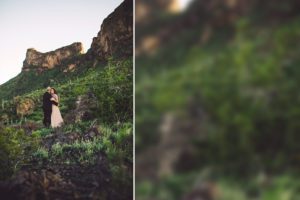 Surrounded by green desert fauna and rugged mountain peaks, this couple holds each other during their engagement session at Picacho Peak, Arizona