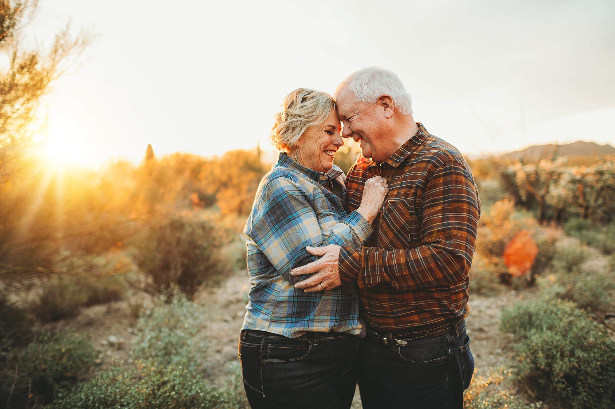 Mom & Dad show their love for one another in the desert sunlight during the Lindley family photo session