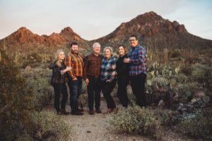 A beautiful sunset family portrait with the mountains of Gate's Pass behind them, the Lindley family during their Tucson family photoshoot