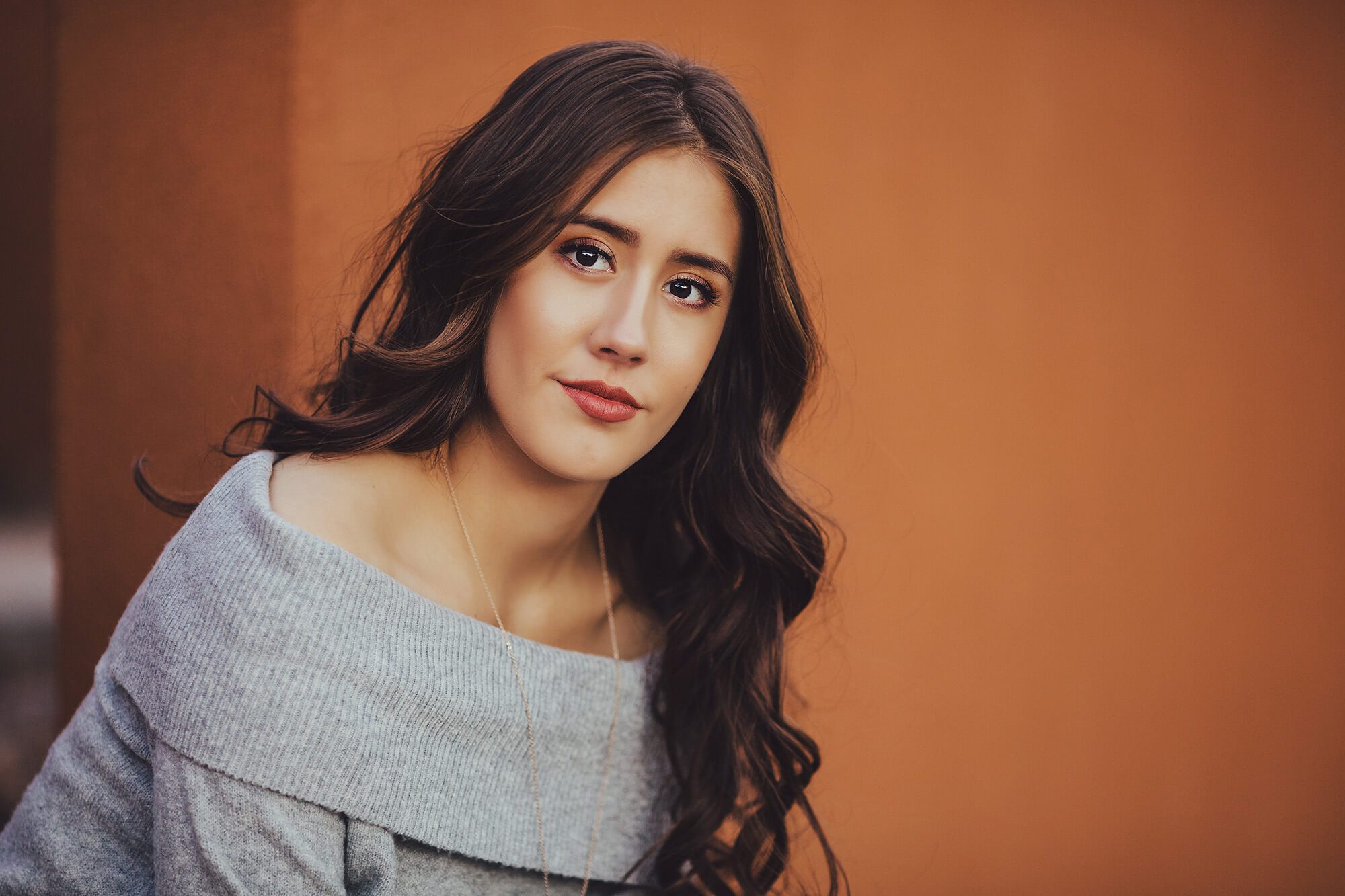 Tucson senior, Brianna, finishes her session with a look that speaks of her beauty, intelligence and passion during her senior photoshoot in the small Tucson neighborhood of Civano