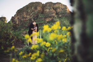 A kiss amongst the Picacho Peak wildflowers for the Paxman's during their couples session