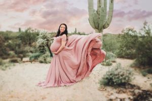 Capturing Christina's dress toss during her maternity session at Saguaro National park