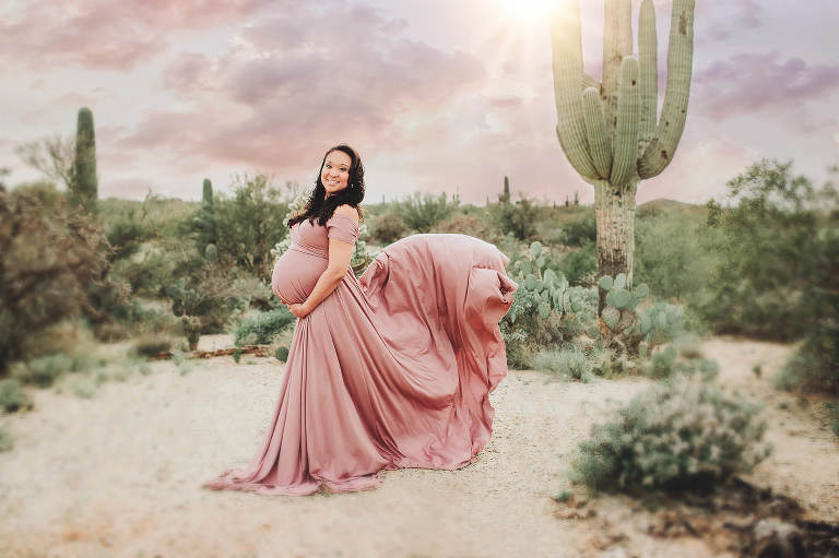 The sun brightened Christina's desert maternity session for a bit with her dress flowing behind her