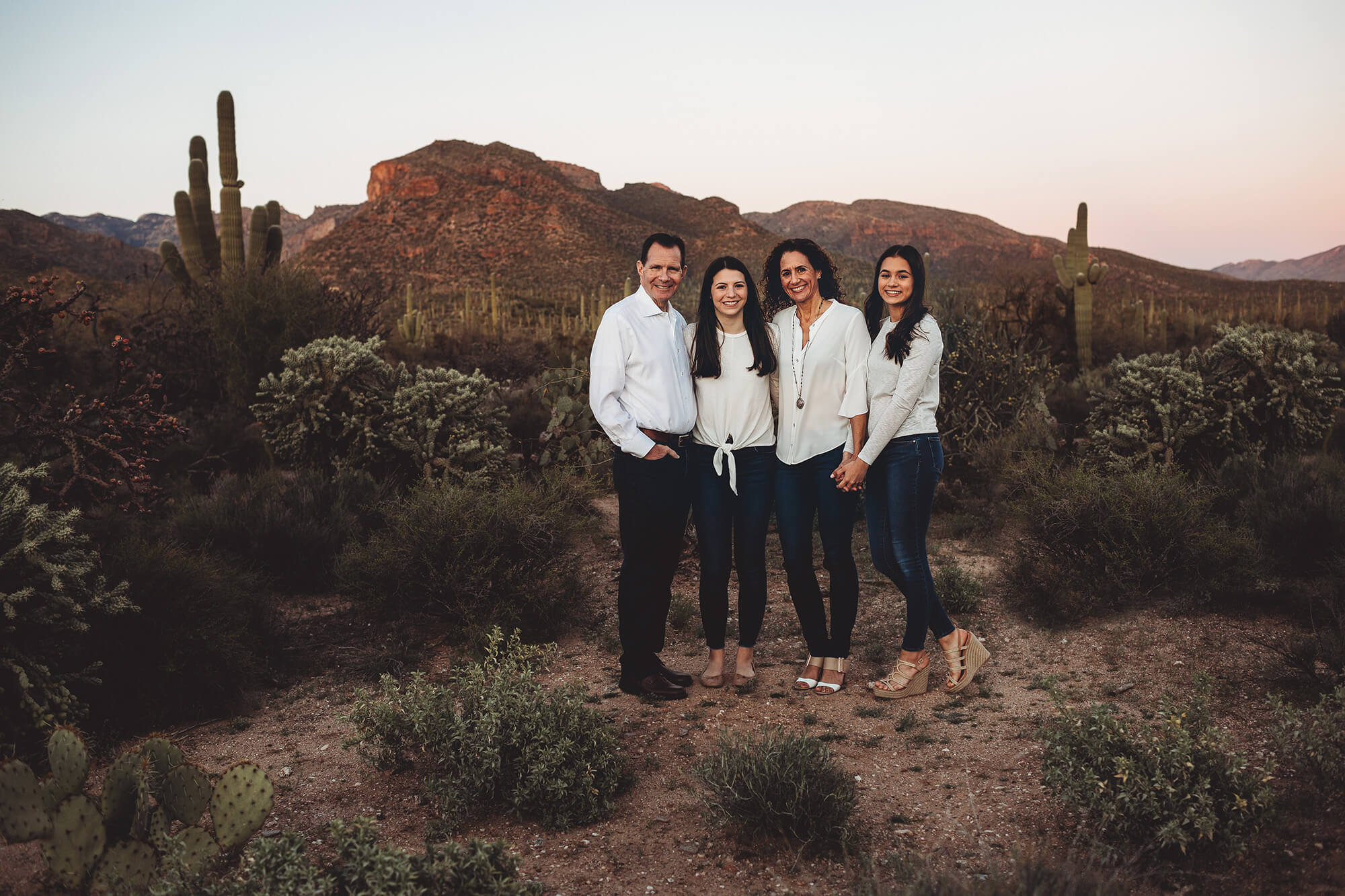 The Marquart family with the Catalina Mountains at their backs during their sunset family session at Sabino Canyon with Belle Vie Photography