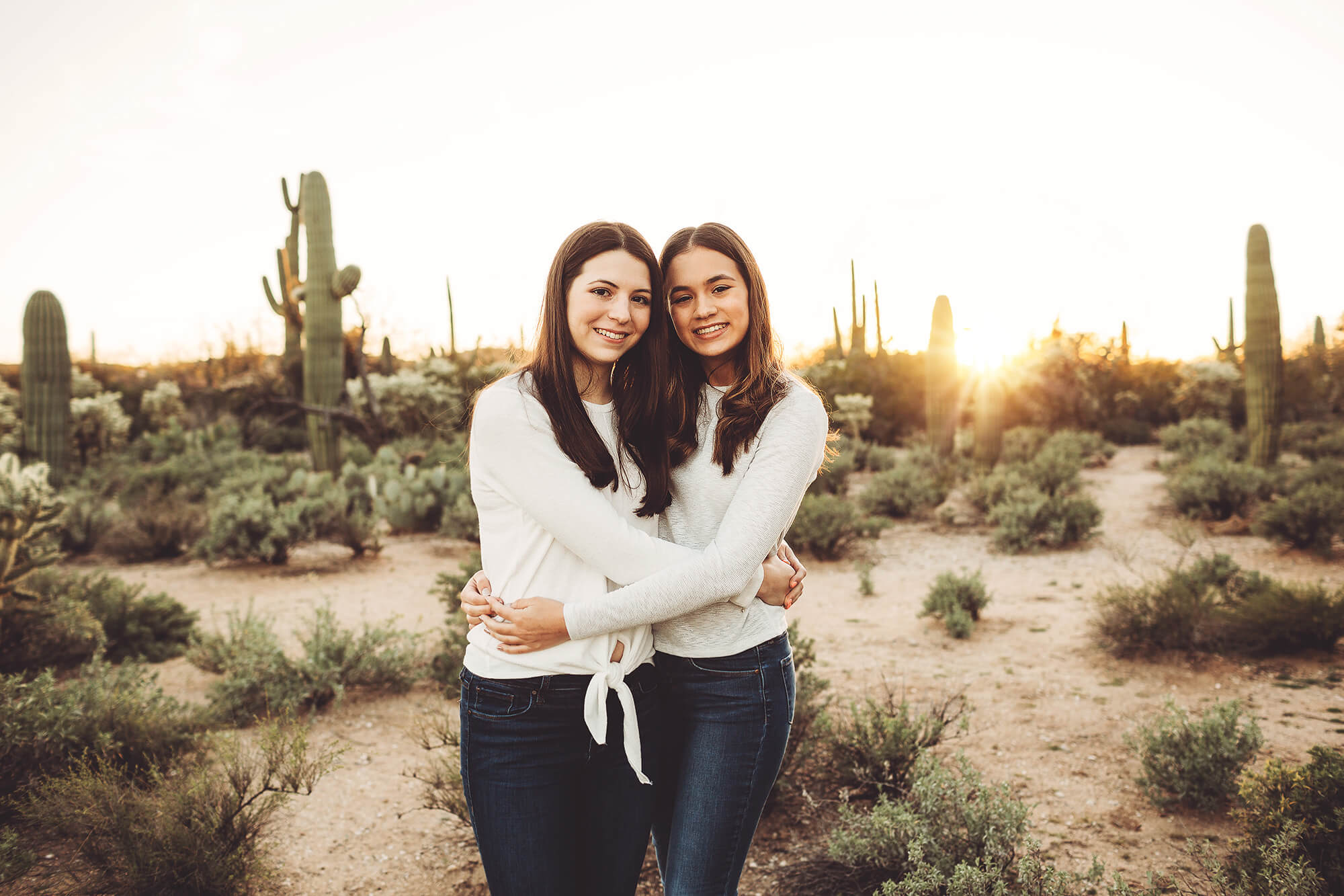 Sisterly hug during their family photo session with Belle Vie Photography at Sabino Canyon