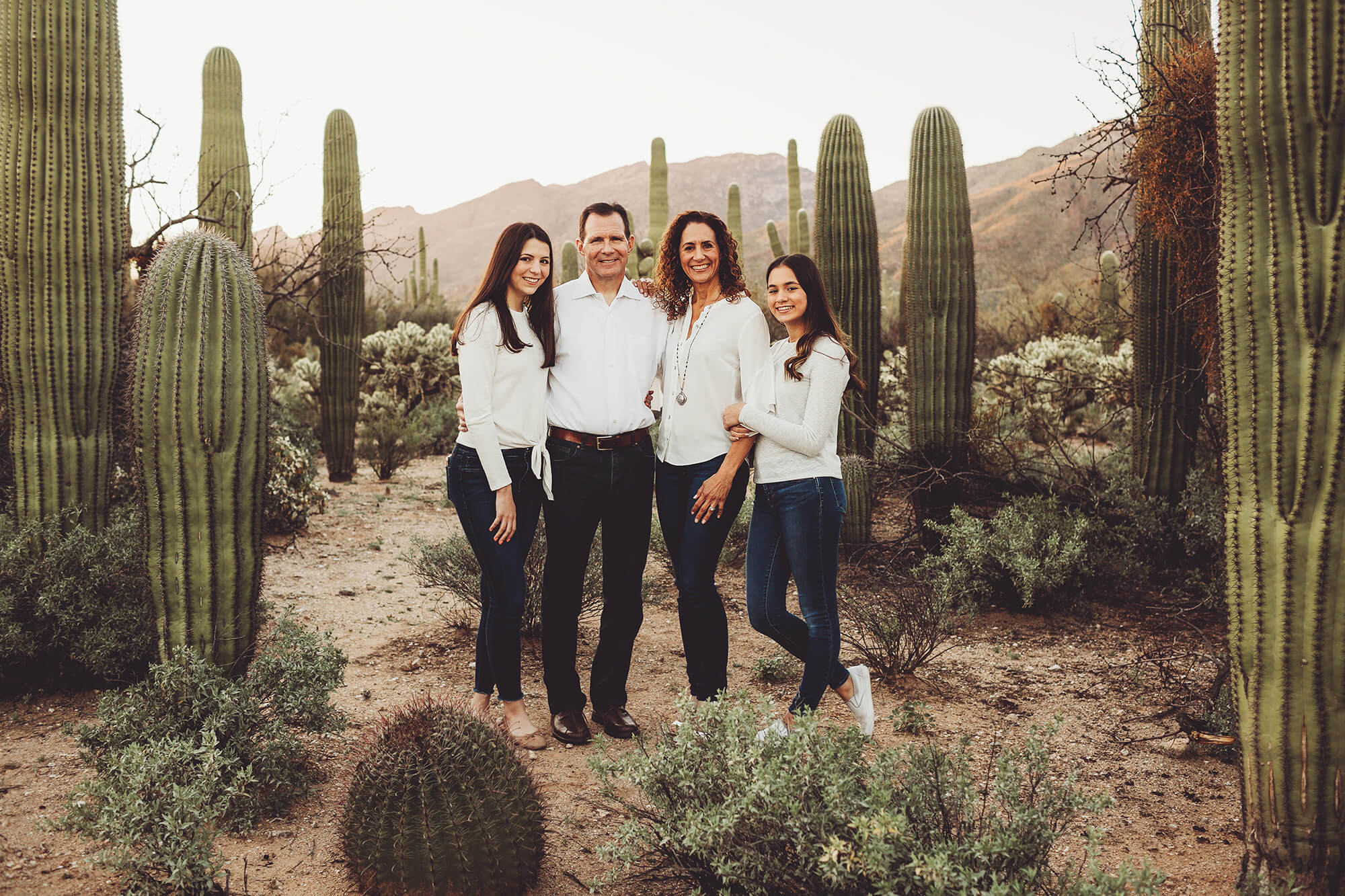 The Marquart family flanked by saguaros at Sabino Canyon in Tucson