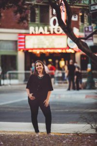 A fun pose for Megan during her headshot session with the Rialto Theater in downtown Tucson in the background