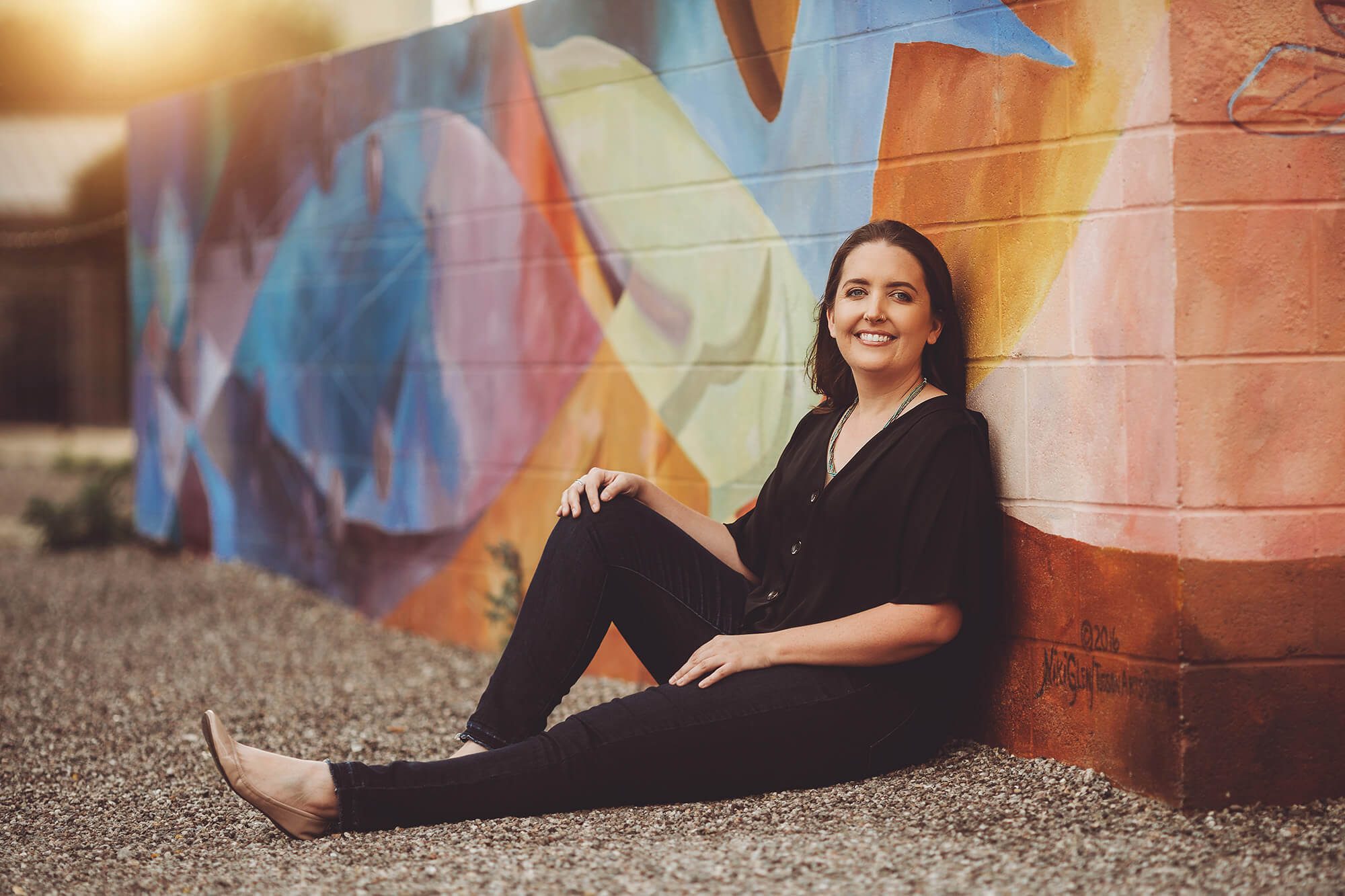 Megan during her headshot session at one of Tucson's beautiful mural walls
