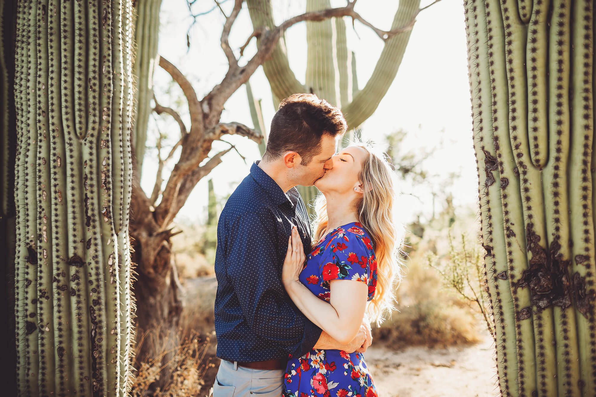Shaun and Ally embrace surrounded by sunlight during their couple's session with Tucson couple's photographer Belle Vie Photography
