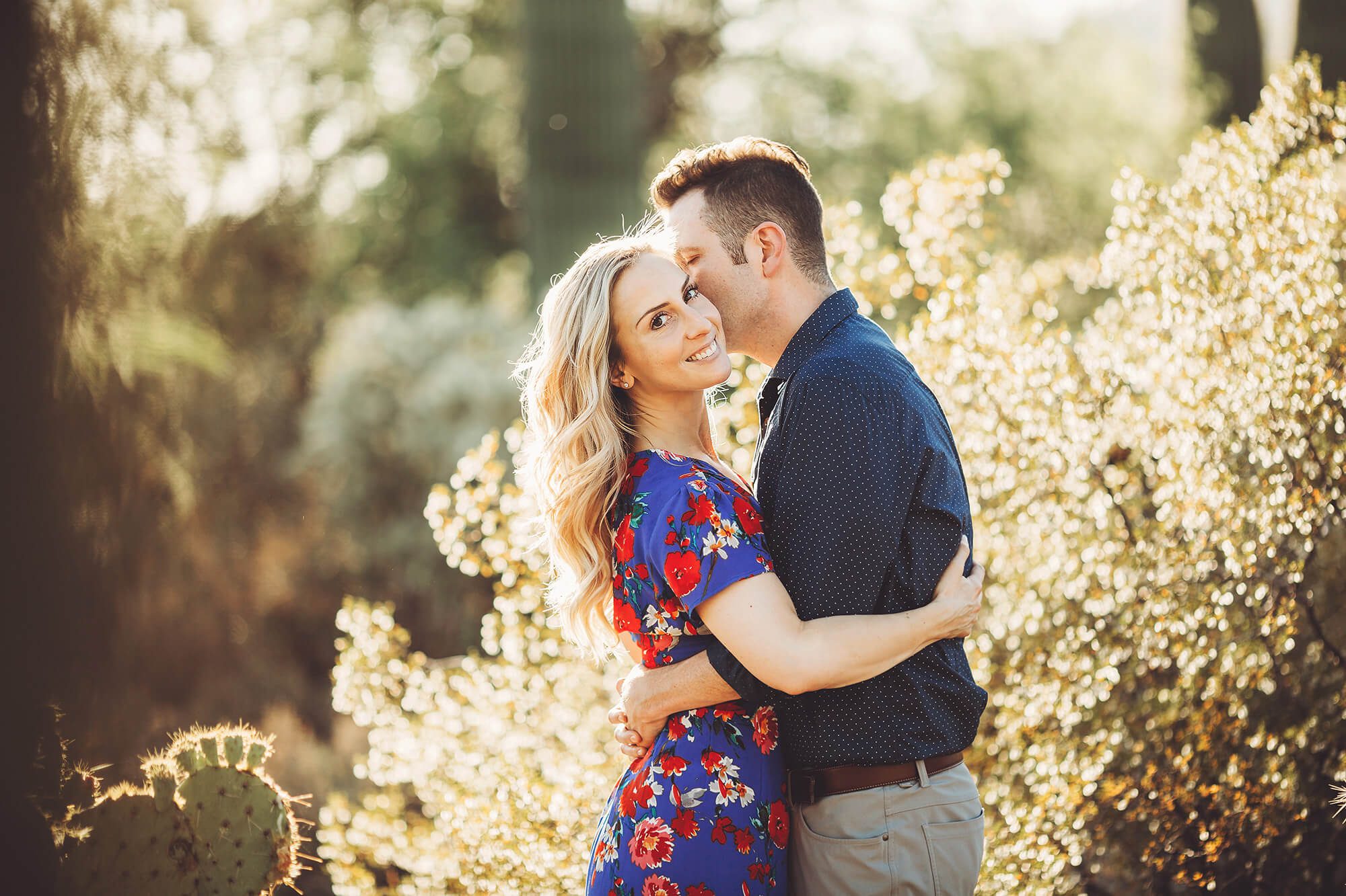 A loving kiss by Shaun on Ally's cheek during their Sabino Canyon engagement session