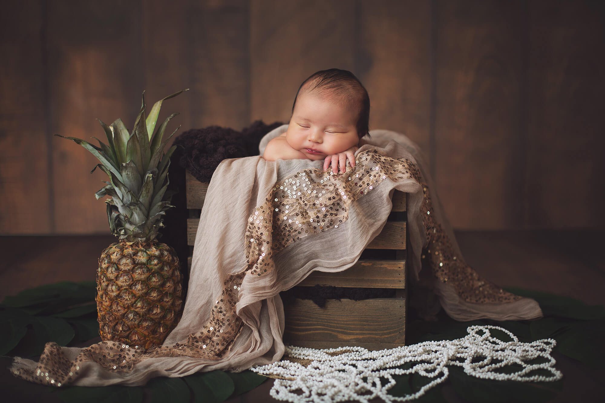 A Hawaiian theme to represent her name, with palm fronds and seashell necklaces