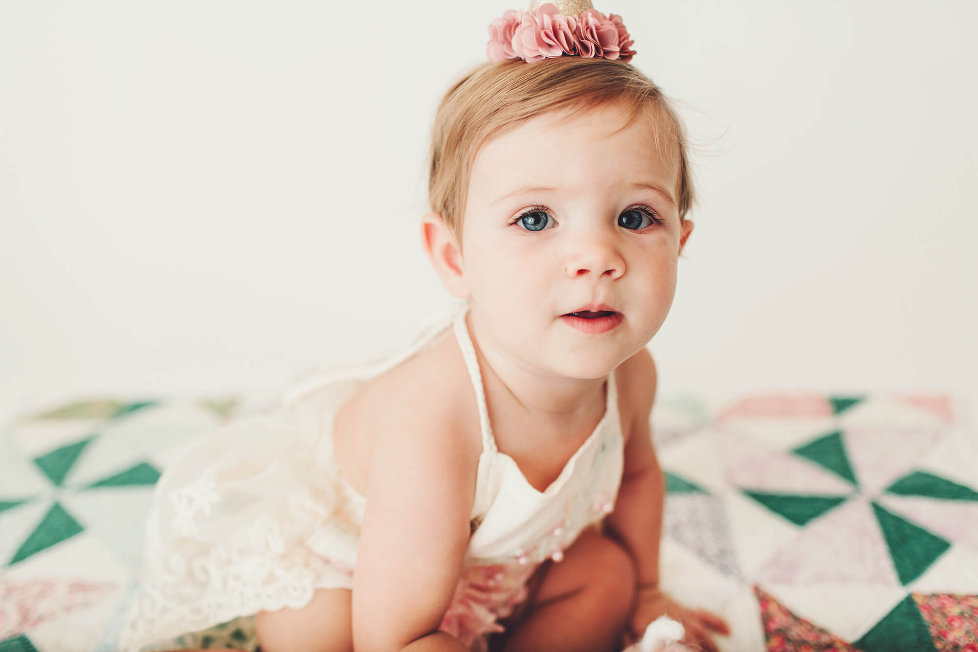 A cute closeup of little Alma on the quilt during her studio session