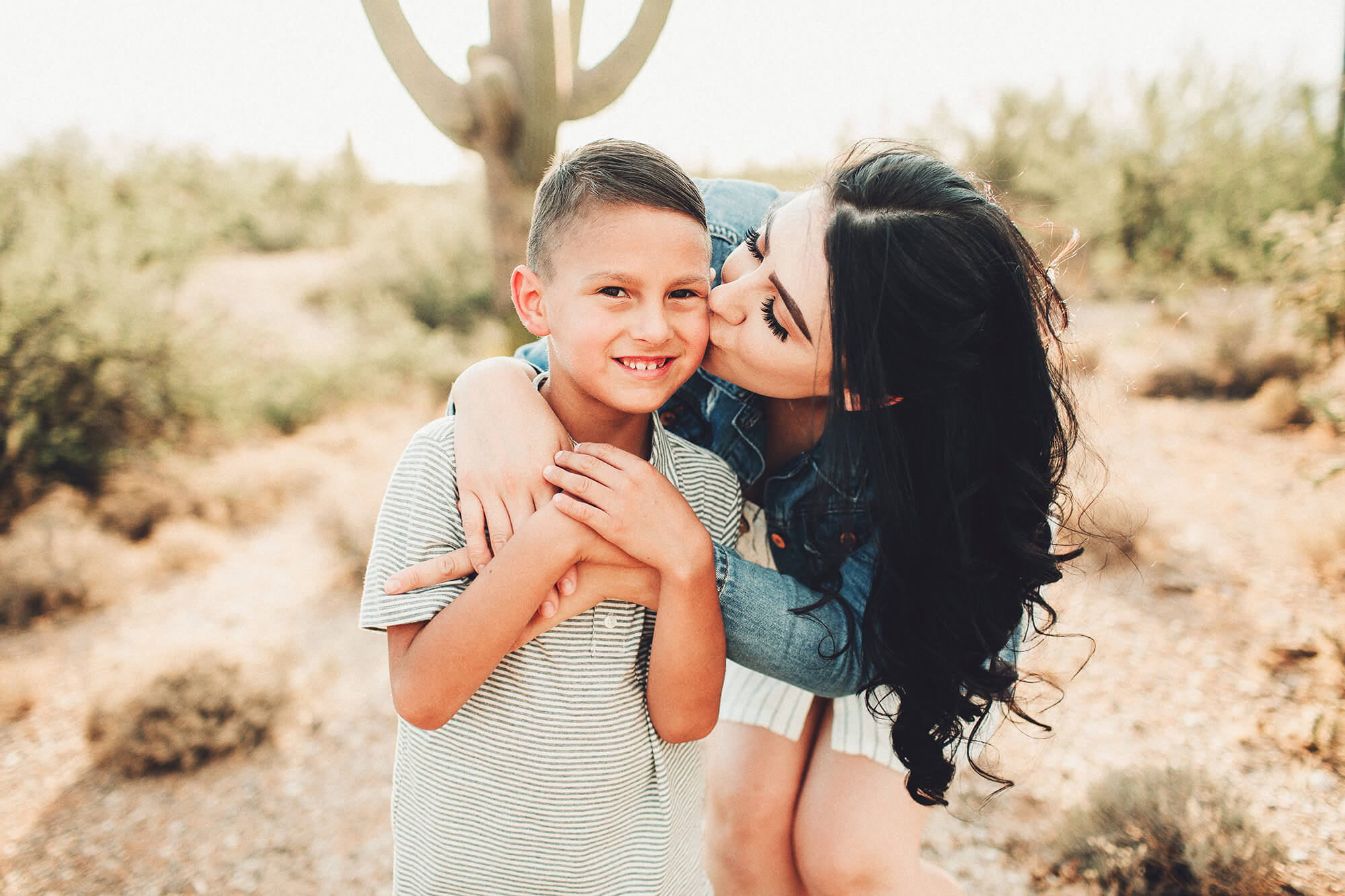 A mom kisses her son during the Galindo's family session