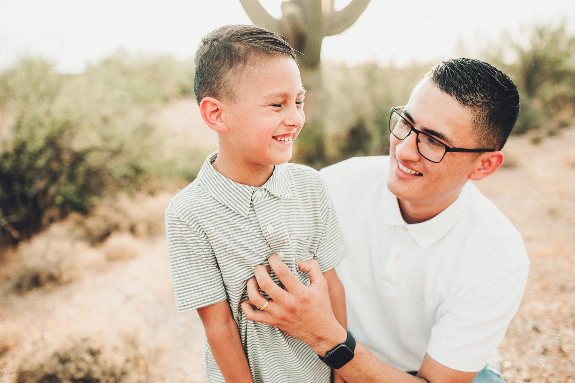 Nothing better than tickles from dad during this desert session at Saguaro National Park