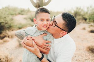 Kisses from dad during this desert family session