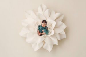 Beautiful baby Amelia in a giant white felt flower