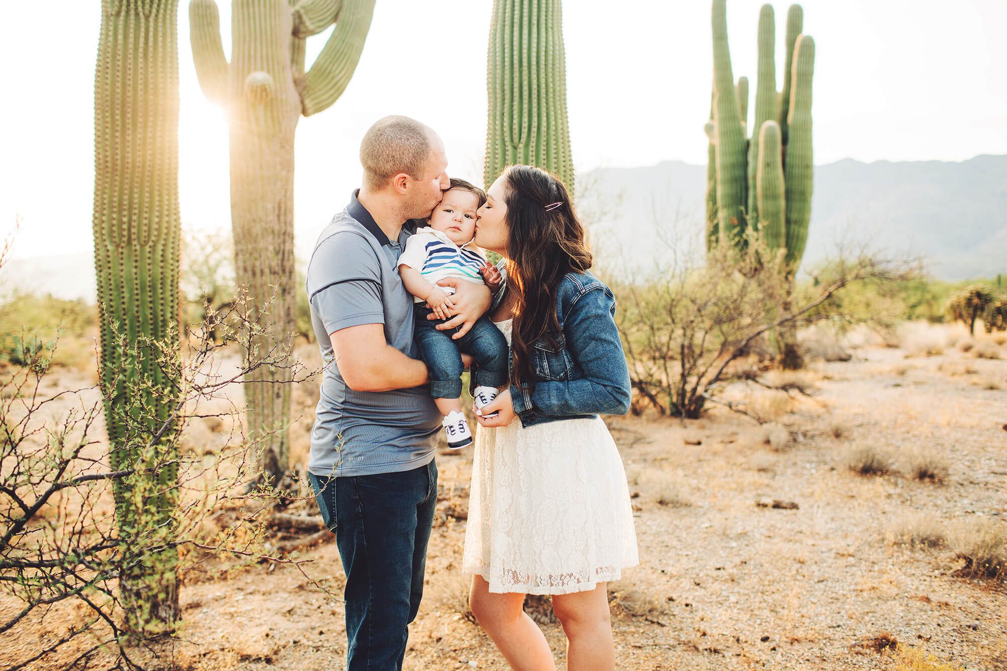 Mom and dad kisses for baby Easton