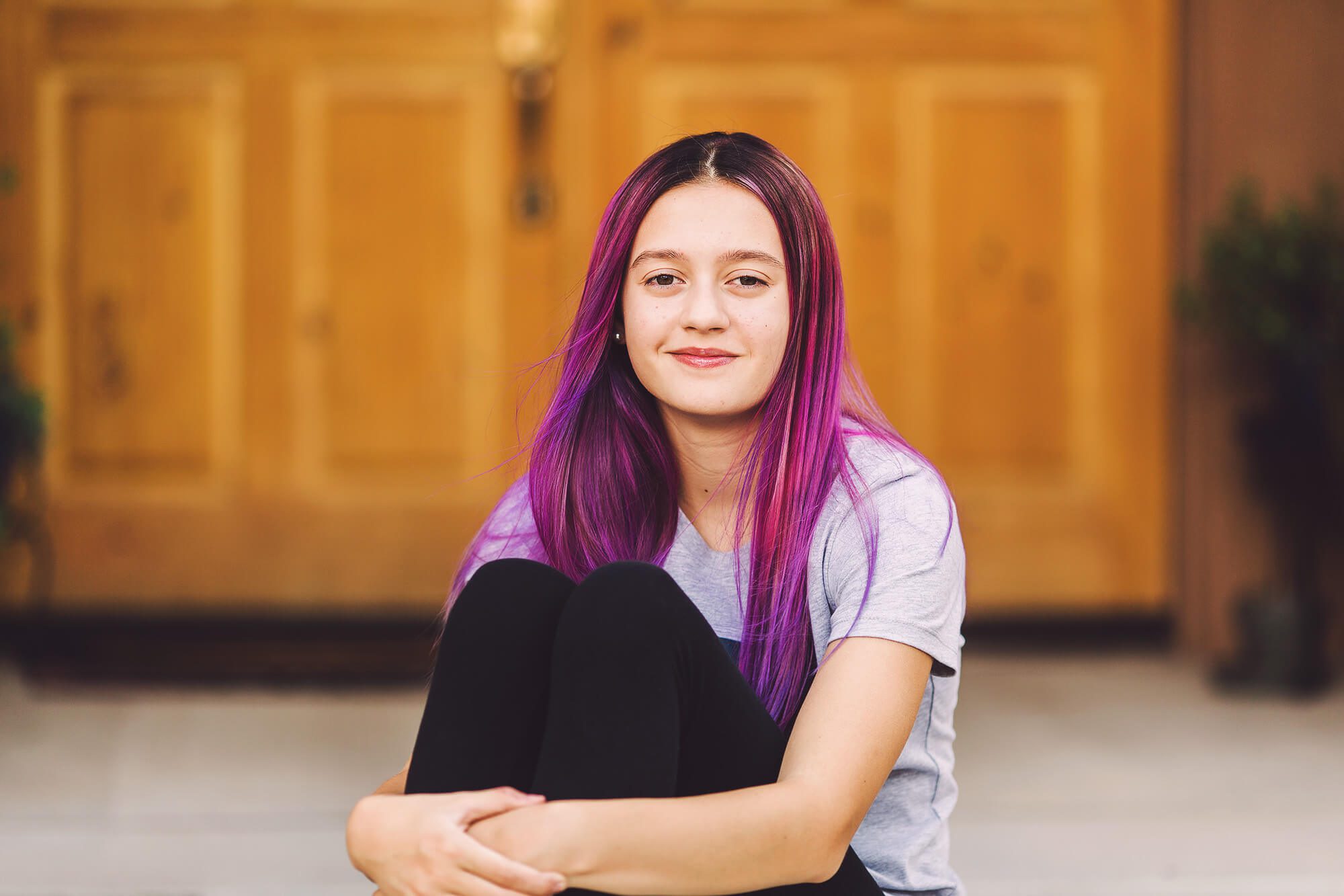 Sitting in front of her home for back-to-school photos