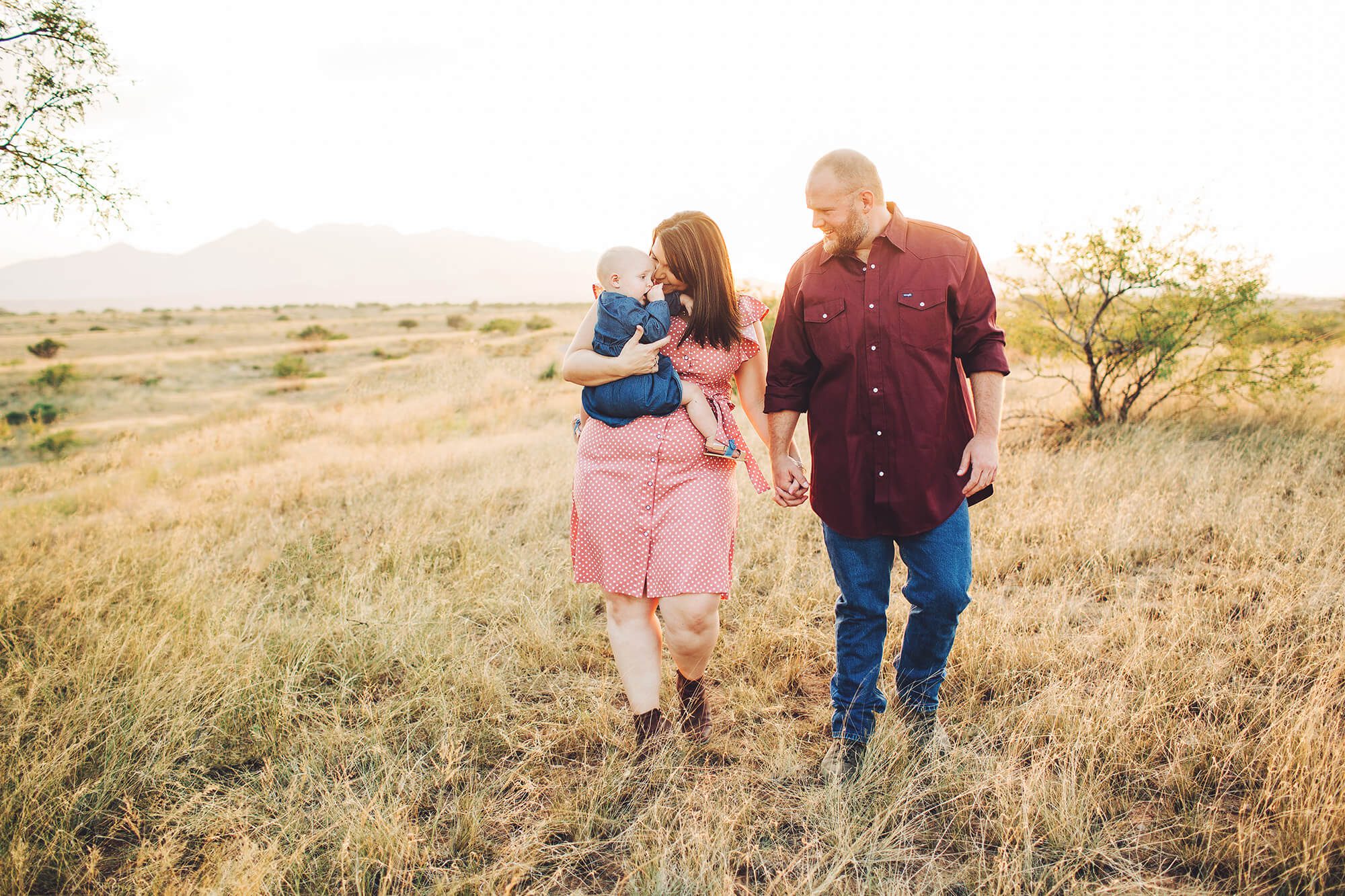 The Tawney family sharing all their love with their daughter.