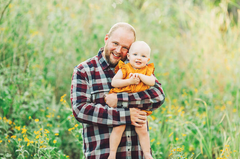 Such sweet smiles for this dad and his little girl during the Tawney's family photo session.
