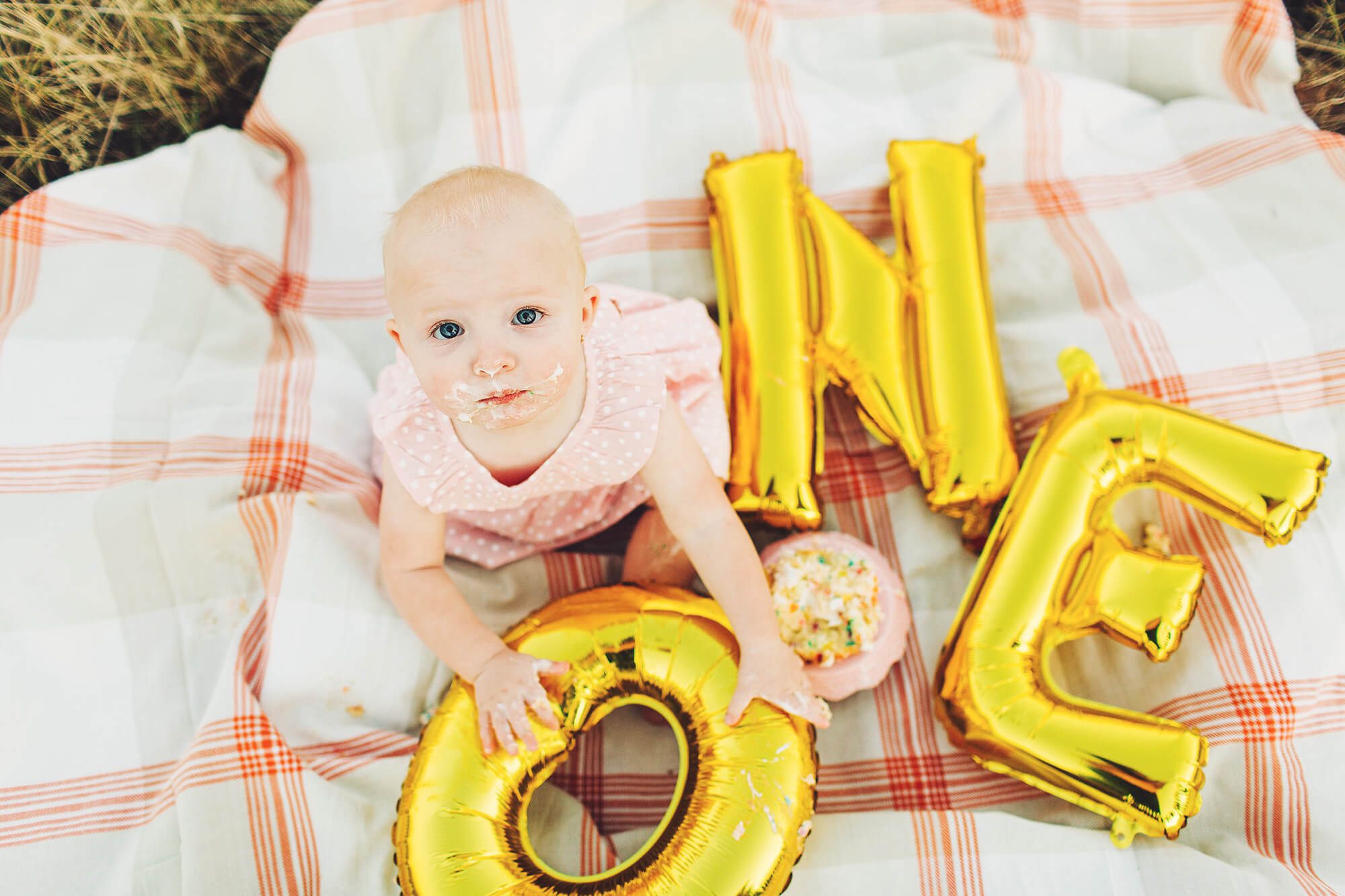 Turning one and covered in cake. My favorite cake smash photo!