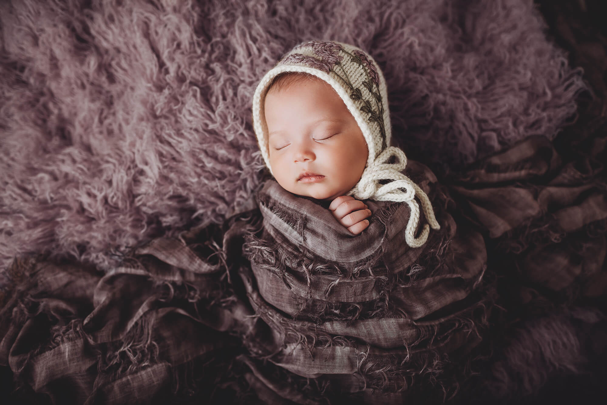 A lavender bonnet for Rubi during her newborn session
