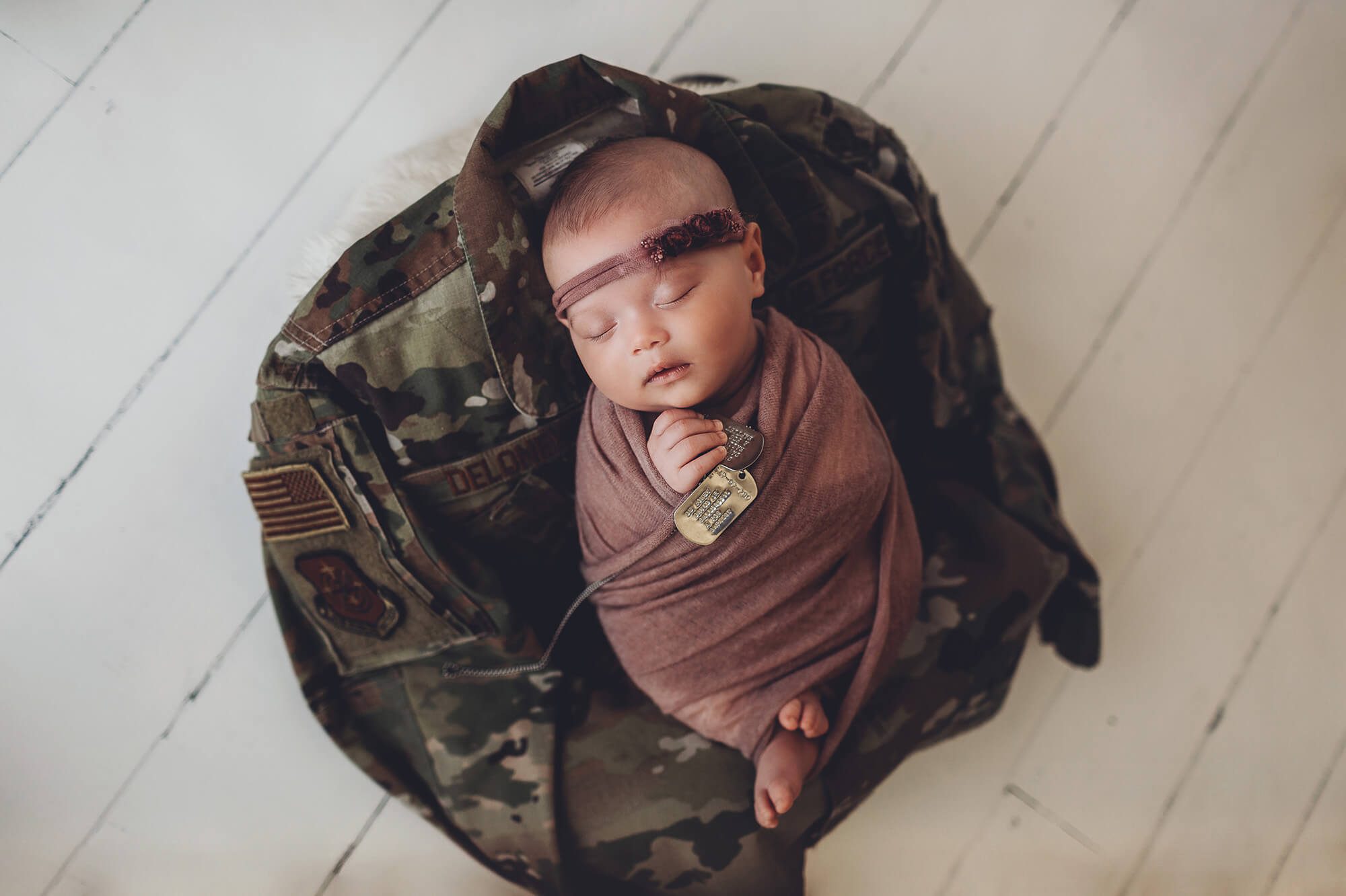 Ruby with military shirt and dog tags from her mom and dad.