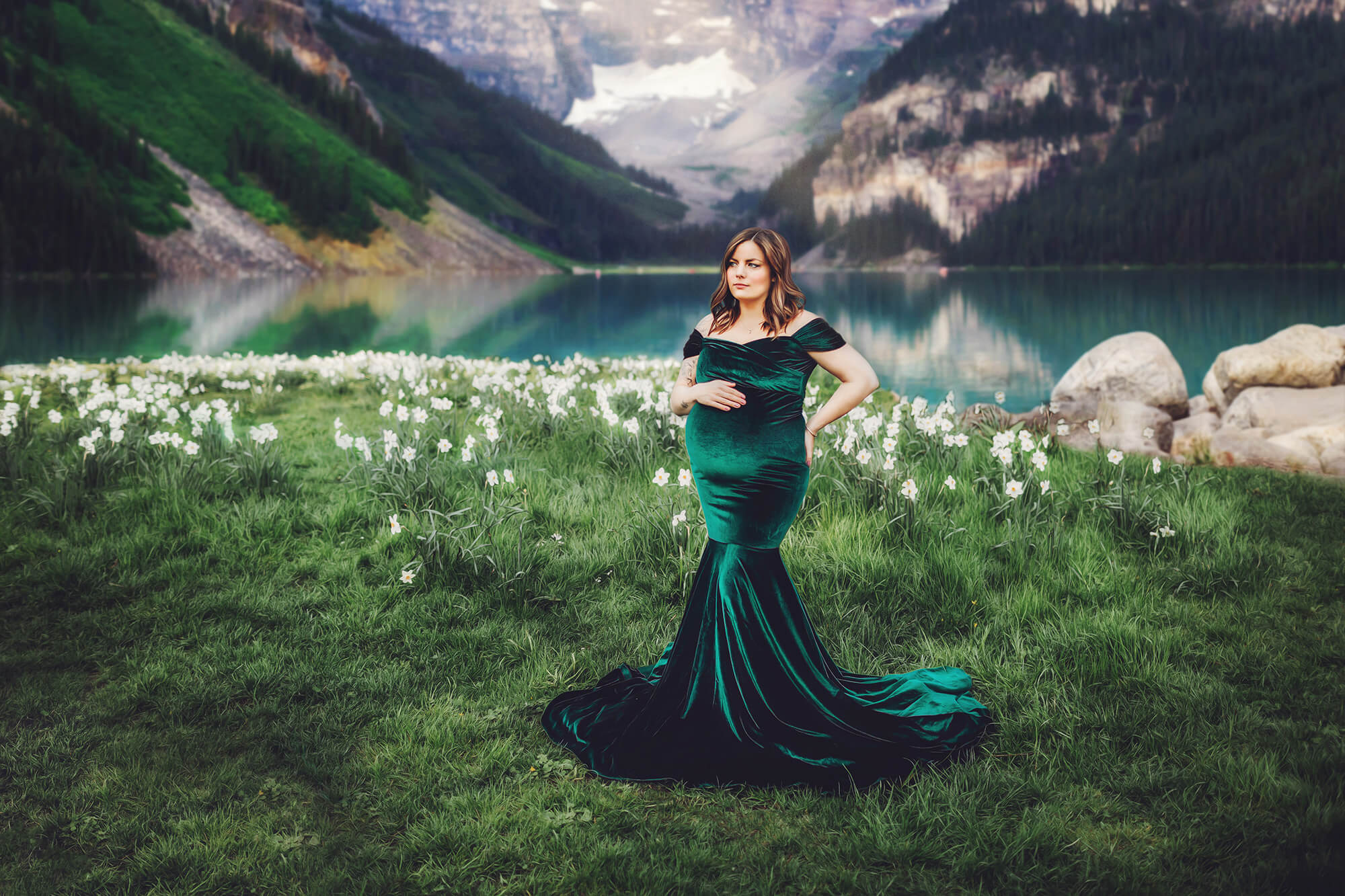 An artistic rendering of Christina during her maternity session with a lake in the background.