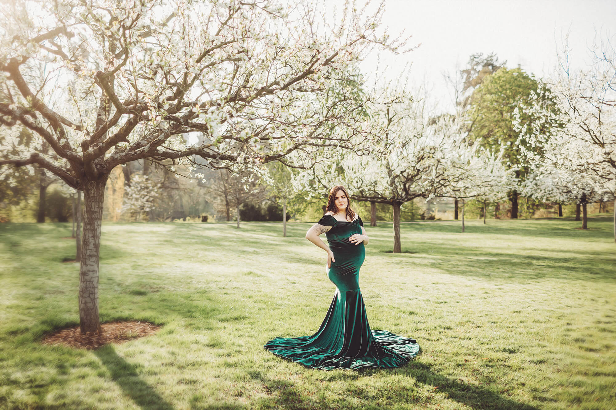 Spring trees covered in white blossoms create a beautiful backdrop for this Bad Homburg maternity session
