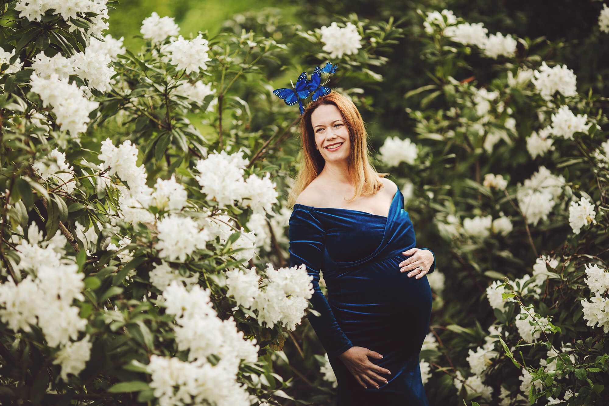 A beautiful smile as Evie poses amongst the rhododendrons