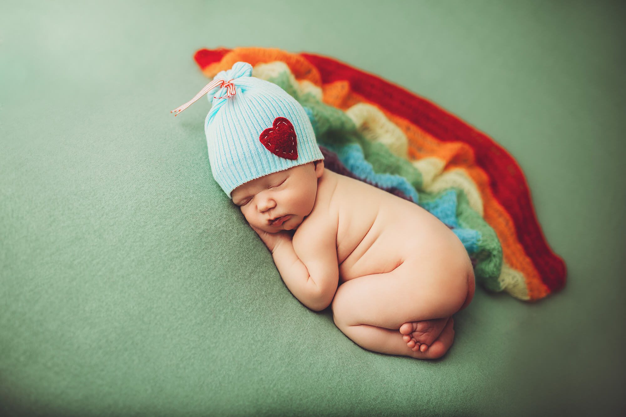 Baby Hudsen with more rainbow and a blue hat
